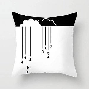 Close-up of square cushion cover featuring minimalist black and white cloud and rain print