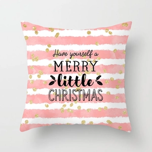 Detail of pink marble geometric cushion cover with gold polka dots and Christmas greeting