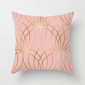 Detail of pink marble throw pillow cover with golden geometric Art Deco pattern