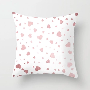 Detailed view of pink glitter heart patterns on a white square decorative pillowcase