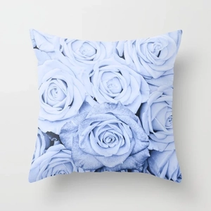 Detailed view of square blue throw pillow cover with vintage rose floral pattern
