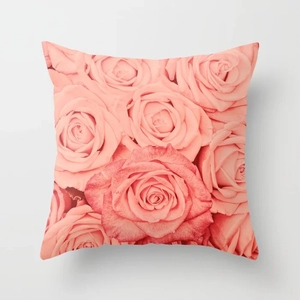 Close-up of soft pillowcase featuring a realistic pink rose floral photography print