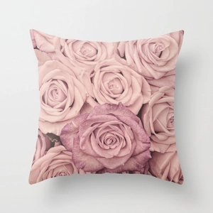 Detailed close-up of soft rose floral print on a square decorative pillowcase cover