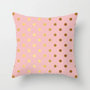 Detailed close-up of pink marble cushion cover with metallic gold polka dots patterns