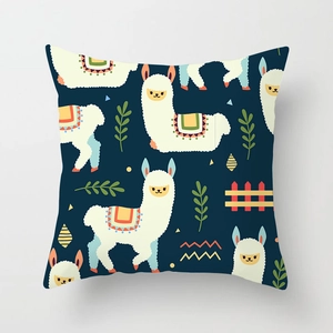 Detail of alpaca pattern throw pillow cover with vibrant navy blue fabric and graphics