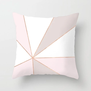 Close-up of pink marble geometric pillow cover with elegant rose gold metallic line detail