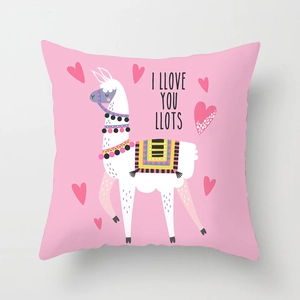 Detailed close-up of pink alpaca cushion cover with heart motifs and colorful textures