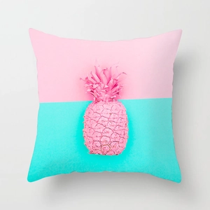 Detail of artistic pink pineapple pattern on a Nordic style square cushion cover