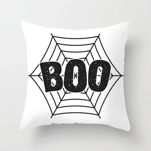 Halloween pillow cover with black spider web and BOO lettering on white peach skin fabric