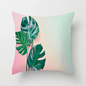 Detail of tropical monstera leaves on pink and mint gradient square pillowcase