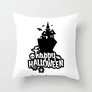 Macro detail of Halloween pillow case stitching and black skull pumpkin print on white fabric