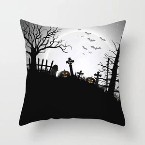 Detail showing Halloween pumpkin and spooky cemetery print on soft peach skin fabric