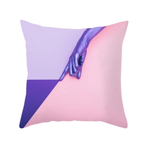 Nordic pink tropical leaf cushion cover with surreal purple hand and geometric pattern