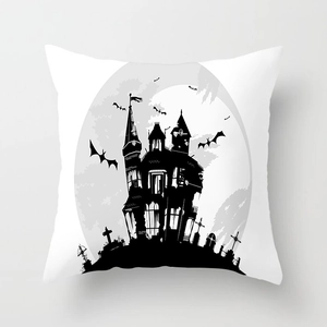 Detail of Halloween pillowcase featuring gothic castle, bats, and full moon on peach skin