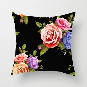 Close-up of floral peach skin pillowcase featuring colorful rose patterns on black