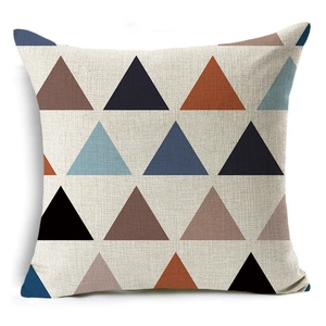Detail of square linen cushion cover featuring modern geometric triangle patterns