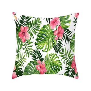 Square peach skin pillowcase featuring vibrant tropical pink hibiscus and green palm leaves