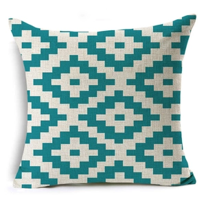 Close-up of geometric teal and cream linen pillowcase with ethnic diamond pattern texture