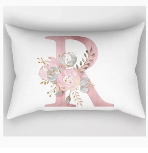 Detailed view of rectangle pillowcase with pink letter R and watercolor floral print