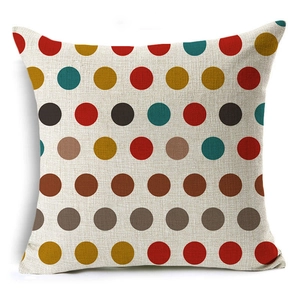 Macro detail of geometric polka dot linen cushion cover with textured weave fabric