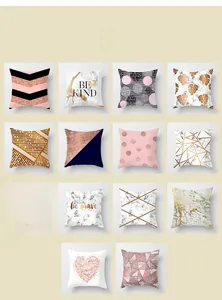 Macro display of 14 modern pink marble and geometric patterns on velvet pillow covers