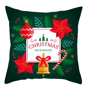 Detail of Christmas pillow cover with floral patterns, bells, and holiday ornaments