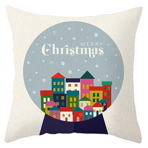 Detail of Christmas pillow cover showing merry christmas text and hand-drawn house pattern