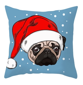 Close-up of square Christmas pillowcase with cute pug dog wearing a red Santa hat and snowflakes