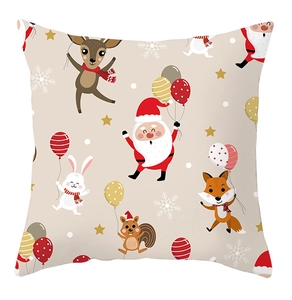 Close-up of festive Christmas cushion cover featuring cartoon animals and holiday patterns