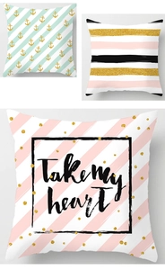 Detailed views of geometric pillow covers with mint stripes, pink patterns and anchor designs