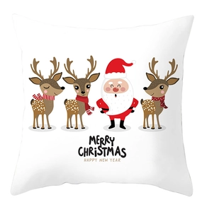 Detail of white square cushion cover with festive reindeer and Santa Claus print