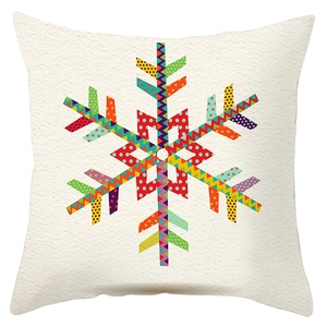 Close-up detail of geometric snowflake pattern on soft peach skin fabric cushion cover