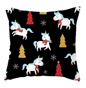 Detail of Christmas throw pillow case with cartoon unicorn and festive snowflake pattern
