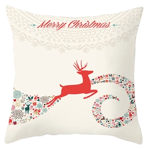 Close-up of peach skin pillowcase with red reindeer and Merry Christmas script