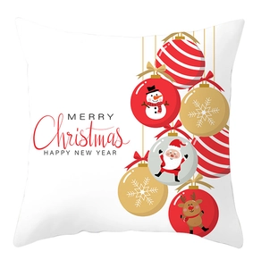 Detail of Christmas pillow cover with festive red ornaments and Merry Christmas text