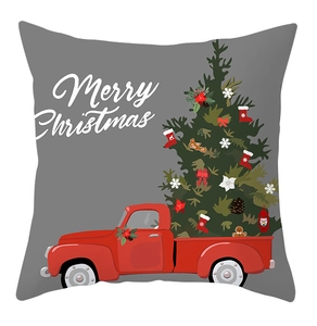 Detail of Christmas pillowcase with red truck, holiday tree and Merry Christmas text