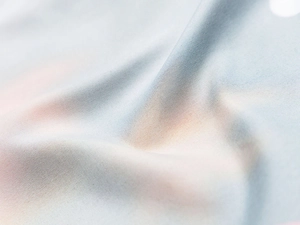 Macro detail of breathable light blue synthetic fiber fabric with fine woven texture