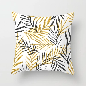 Detail of peach skin fabric pillowcase with black and gold palm leaf art print