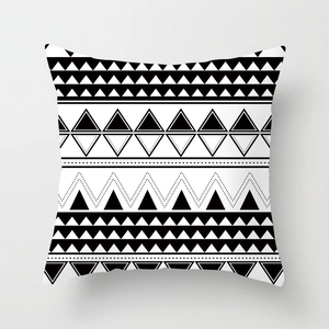 Detailed view of square pillow cover with black and white geometric Nordic patterns