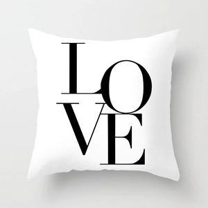 Modern white square pillow case featuring bold black LOVE typographic design for sofa decor