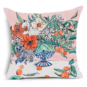 Artistic linen pillowcase showing a blue striped vase with orange lilies and floral patterns