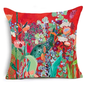 Detail view of abstract red linen pillowcase featuring dense floral and botanical patterns