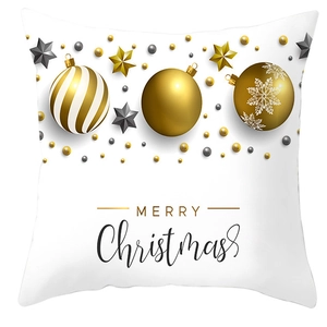 Close-up of golden and grey Christmas ball patterns on white peach skin pillowcase