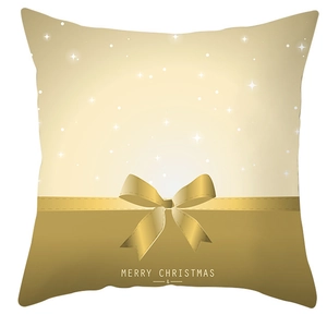 Detail of Christmas pillowcase with golden ribbon bow and Merry Christmas text