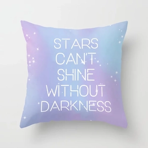 Detail of quote print Stars Can't Shine Without Darkness on sky blue cushion cover