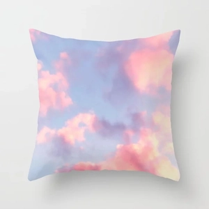 Detailed view of pink clouds gradient pattern on soft peach skin fabric cushion cover