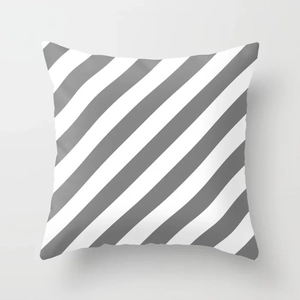 Close-up of geometric grey and white striped peach skin pillowcase with a soft texture