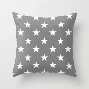 Detail showing high-quality peach skin fabric and white star pattern on gray pillowcase