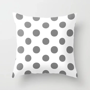 Detail of square peach skin pillowcase featuring a modern grey polka dot pattern