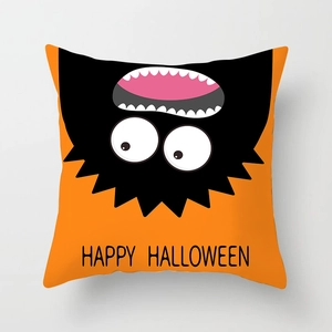 Detail of Halloween pillowcase with orange background and Happy Halloween text design